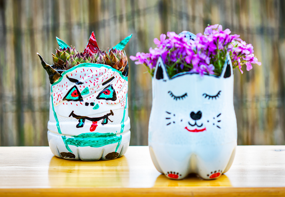 Plat pots made from the bottom of two plastic bottles and decorated with paint Plat pots made from the bottom of two plastic bottles and decorated with paint