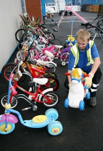 Recycling Centre Staff A member of staff at Pinbrook Recycling Centre sorts our children's ride on toys for resale in the Reuse Shop