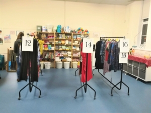 Clothes swish rails Rails of clothes separated into different women's sizes at a clothes swish at Marpool Primary School