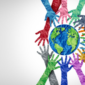 Global education An artistic picture of paper hands surrounding a paper earth. The hands are multi-coloured the earth is green and blue. This is on a white background with a grey gradient.