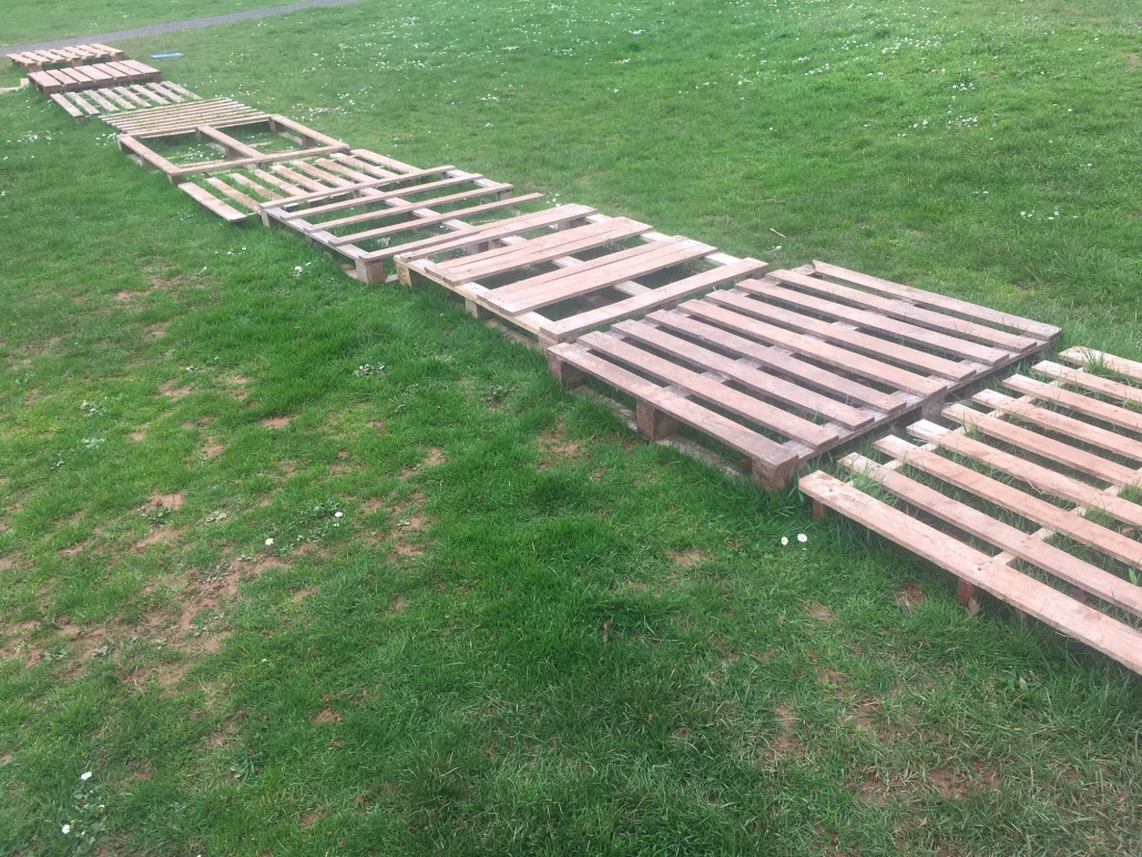 IMG_1156 a pathway made of pallets across grass at Whipton barton loose parts play