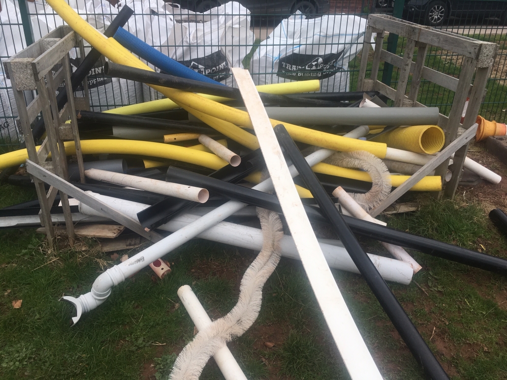 Whipton Barton Junior School Stack of plastic tubing for loose parts play at whipton Barton Junior School