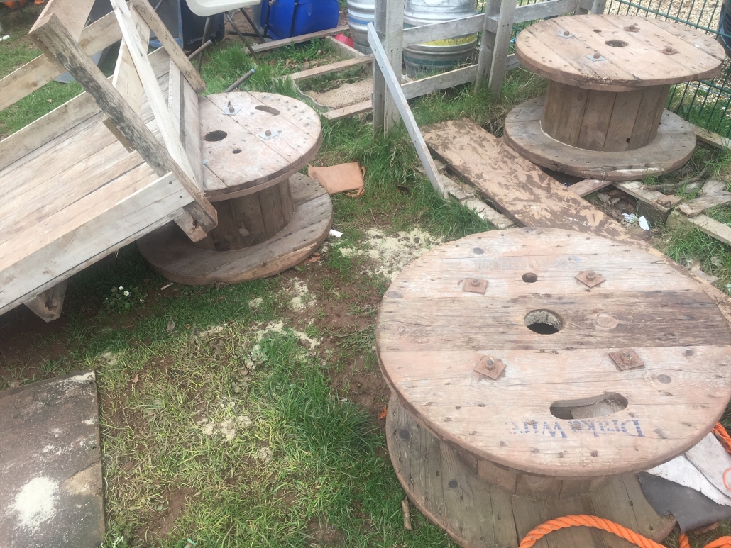IMG_1163 Pile of mixed wooden loose parts play equipment at Whipton Barton Junior School including large cable reels and pallets.