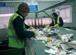 Picture of people working in a materials recycling facility