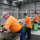 Picture of staff working to sort recycling at a Materials Recycling Facility in New Zealand