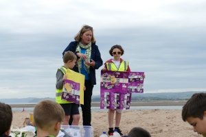 Woman and two children comparing the plastic packaging from a multi pack and a large bag of popcorn Woman and two children comparing the plastic packaging from a multi pack and a large bag of popcorn