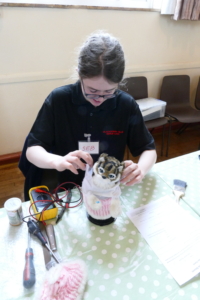 P1060061 Seb at a repair cafe. Repairing a mechanical cat