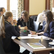 students talk through a problem in a team