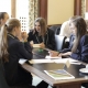 students talk through a problem in a team