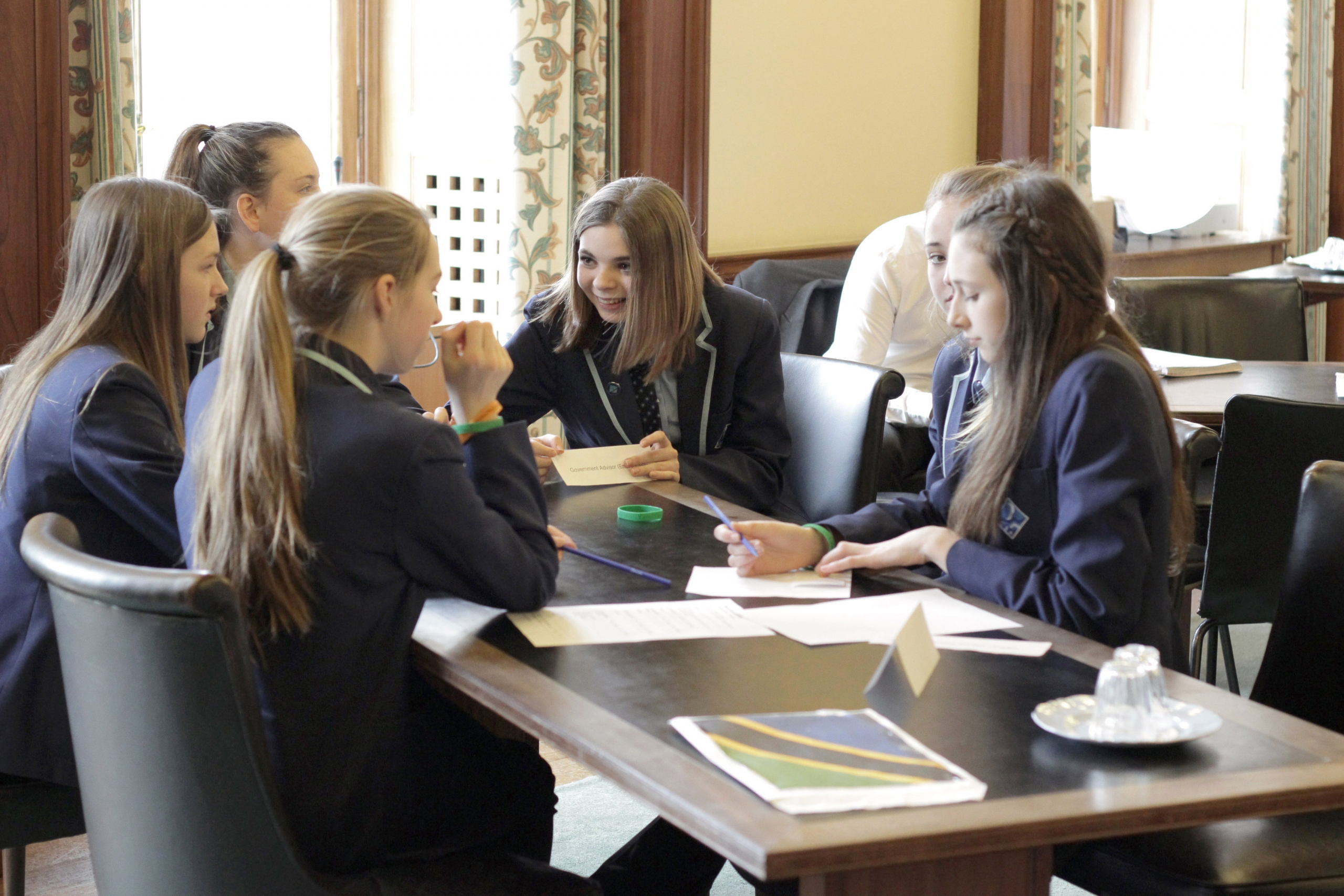 Students working collaboratively students talk through a problem in a team