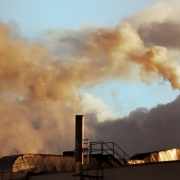 Air pollution Picture of chimneys with yellow coloured smoke emerging