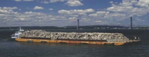 Real Garbage Barge Picture of the real garbage barge, a boat of rubbish that travelled the coastline of the eastern USA looking for somewhere to dispose of the rubbish