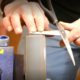 Scissors being sharped on a machine at a repair cafe