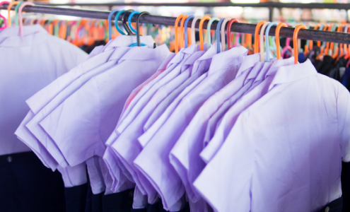School uniform School shirts hanging on a clothes rail