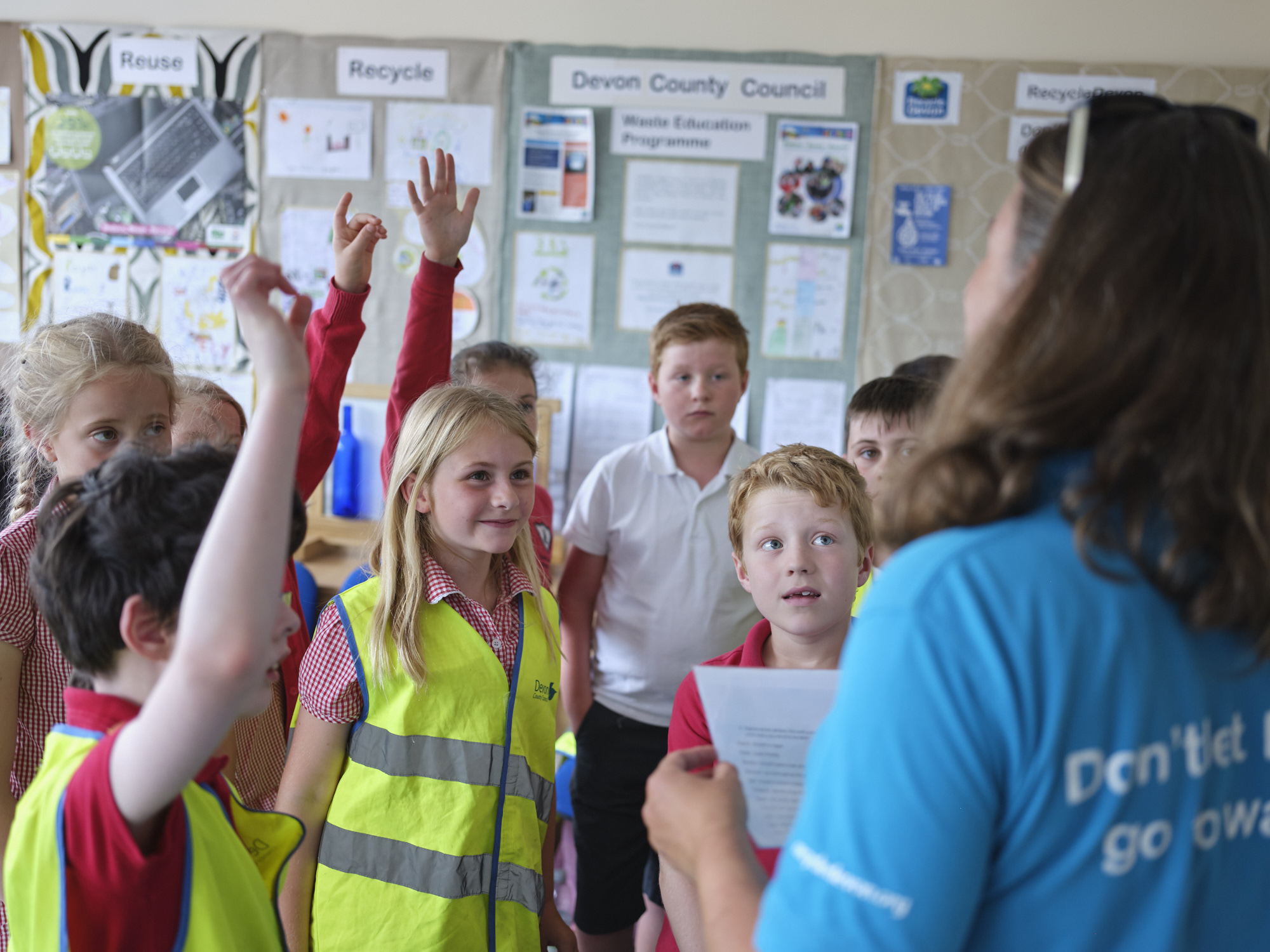 Careers Advice Waste Educator talking to a group of children, some have their hands up