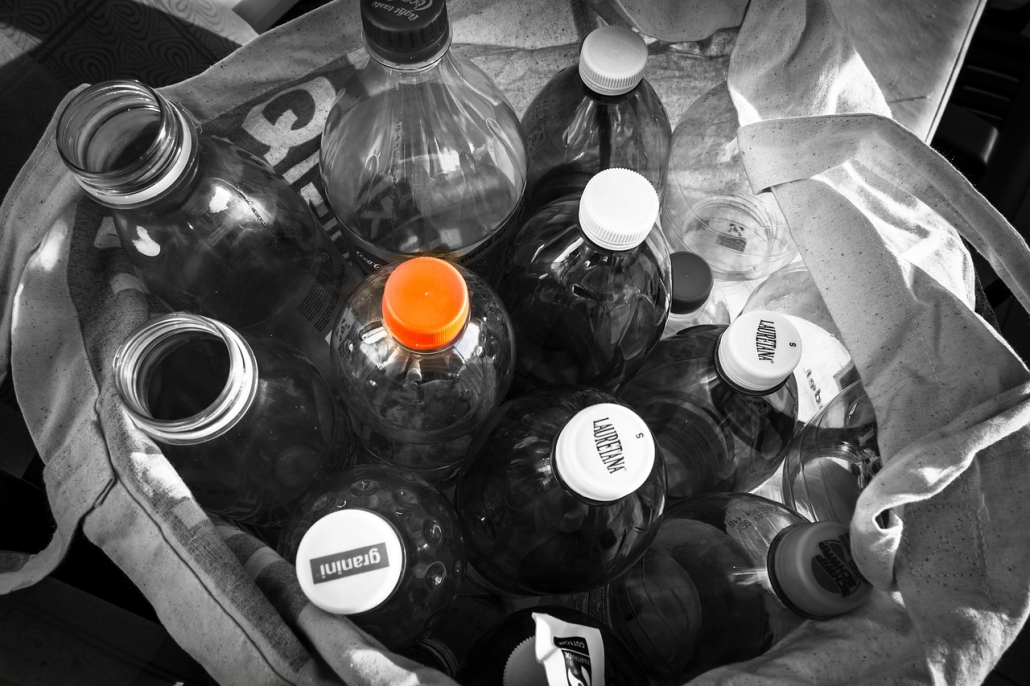 Plastic Plastic bottles in a white recycle bag