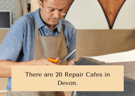 furniture fact 7 Photo of a man holding scissors and fabric with the text: There are 20 repair cafes in Devon.