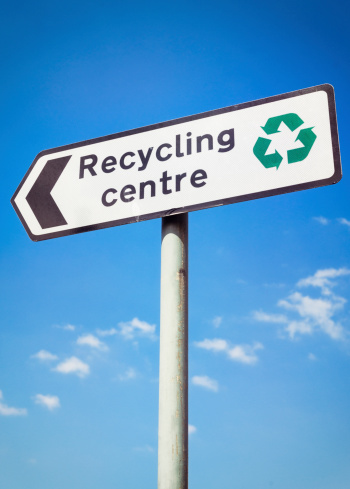 Recycling Centre sign A sign for a public recycling centre, with a green recycling symbol.