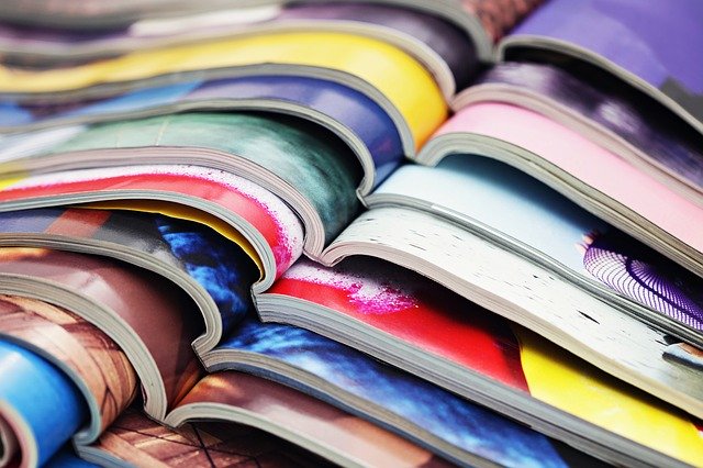Got Magazines? 10 magazines opened and placed on top of one another.