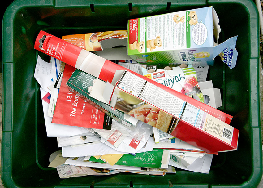 recycling-box Card and paper in a green recycling box