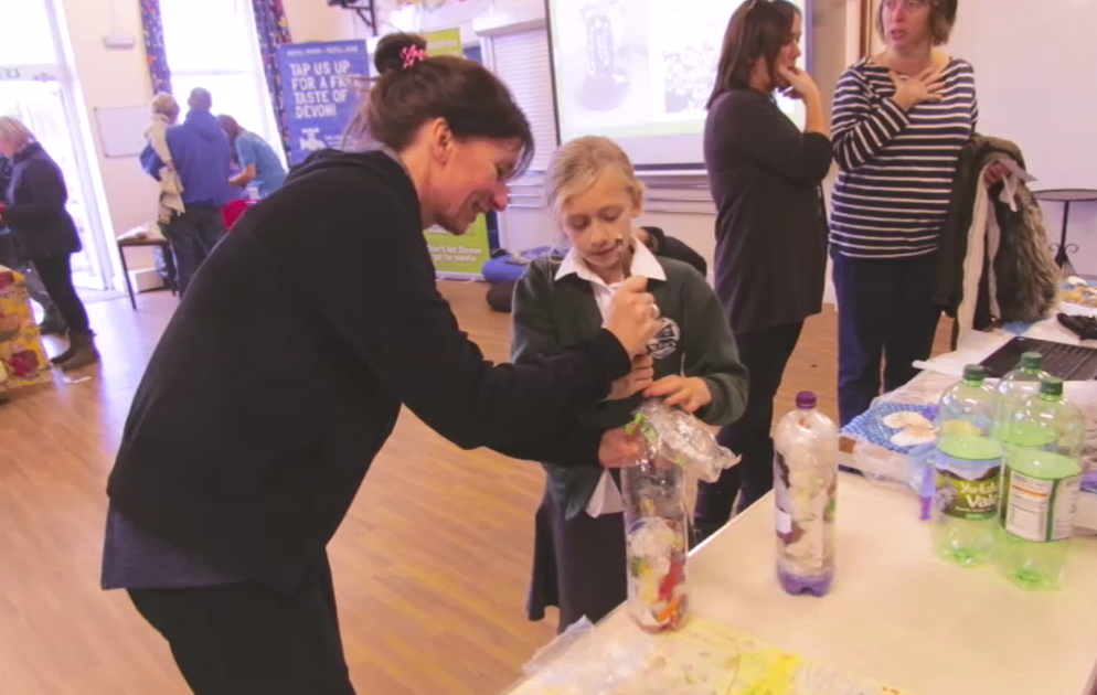 st peters 7 Pupil being shown how to make an Eco-Brick at st Peter's Primary School Eco-Day