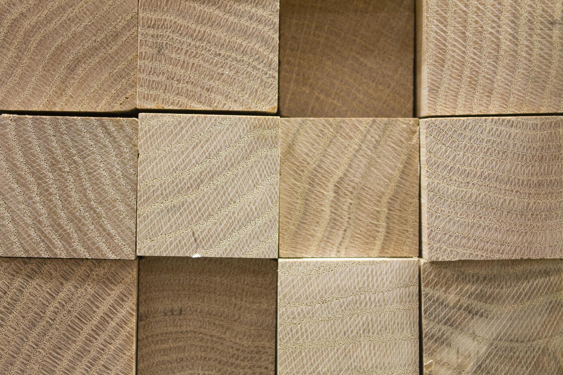 Blocks of wood a picture of blocks of wood arranged in a neat pile, showing the square ends of the different pieces of wood